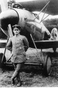 Photograph of Muller standing in front of one of his Albatros 'planes.